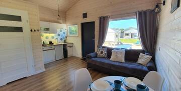 Фото номера Шале с двумя спальнями Дома для отпуска Lumi Resort Domki letniskowe г. Реваль 14