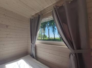 Фото номера Шале с двумя спальнями Дома для отпуска Lumi Resort Domki letniskowe г. Реваль 8