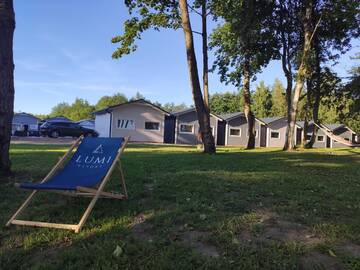 Фото номера Шале с двумя спальнями Дома для отпуска Lumi Resort Domki letniskowe г. Реваль 9